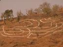 The symbol OM painted onto the hill of the river island let us know that we had arrived in Omkareshwar, a town named for the shape of its river island.